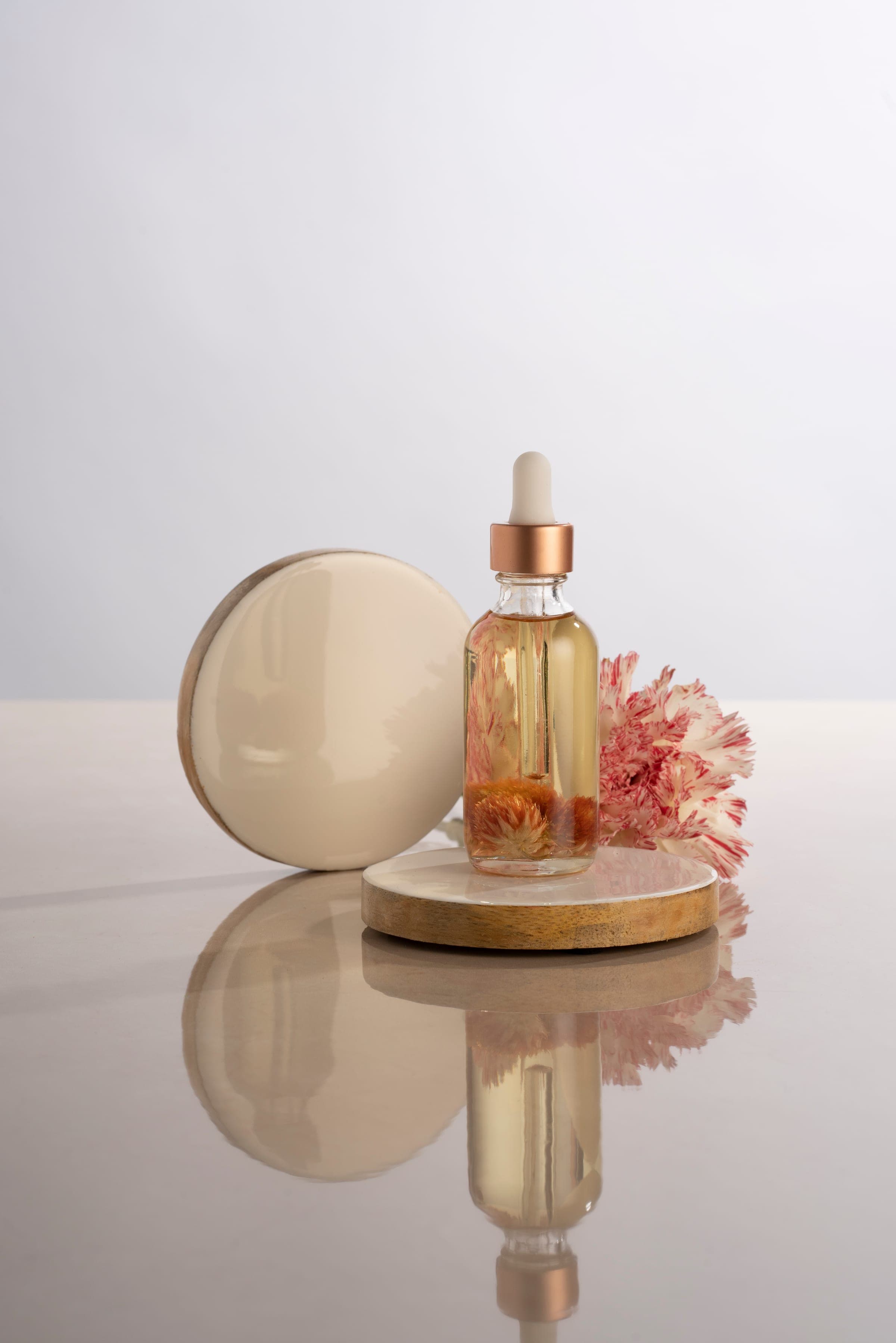 Facial oil bottle with dried flowers