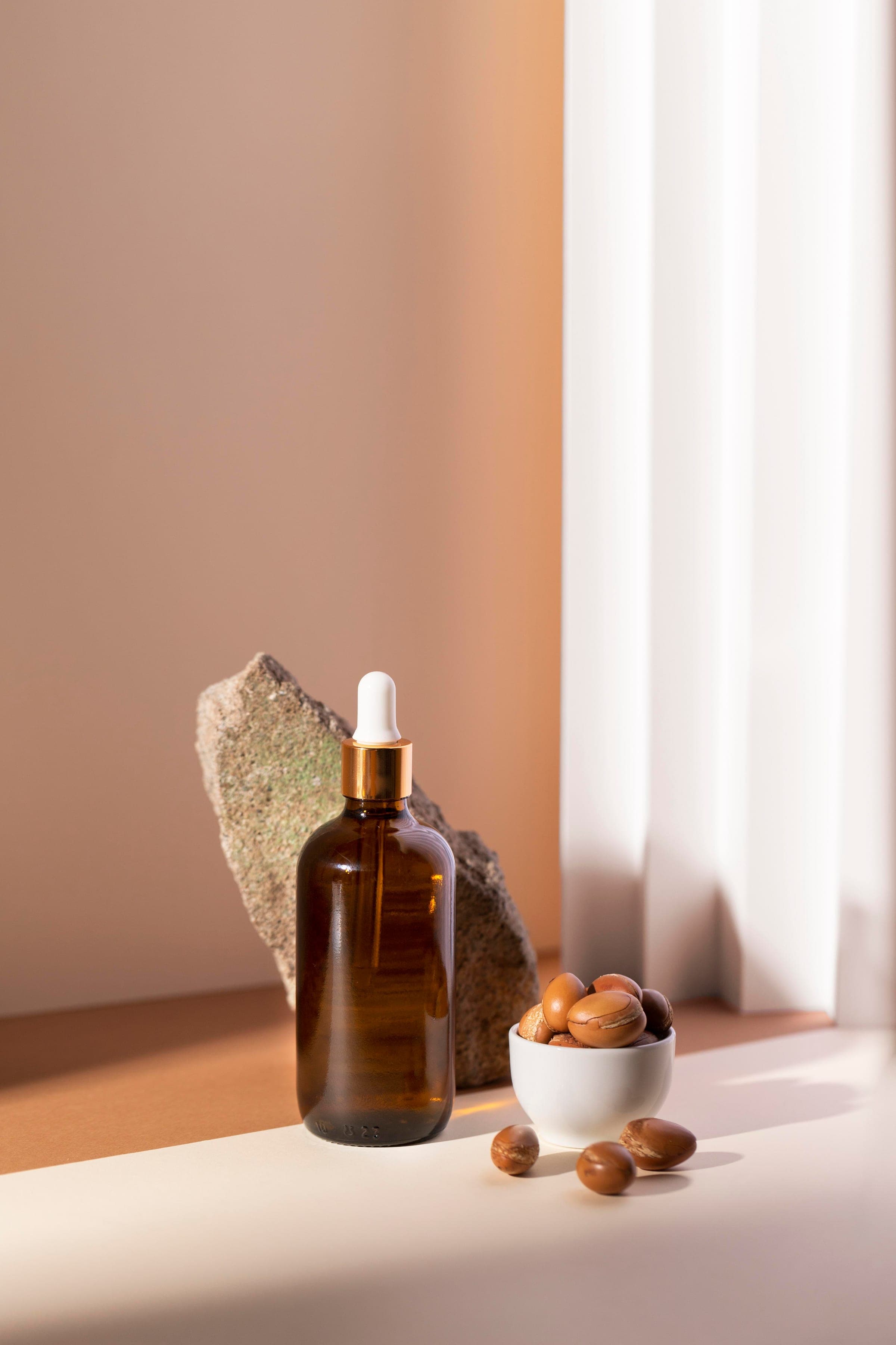 Dropper bottle of serum with natural stone
